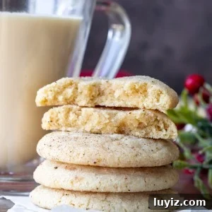 Eggnog Snickerdoodle Cookies: Festive Holiday Cookie Recipe 11 Stack of eggnog snickerdoodles with top cookie broken in half.