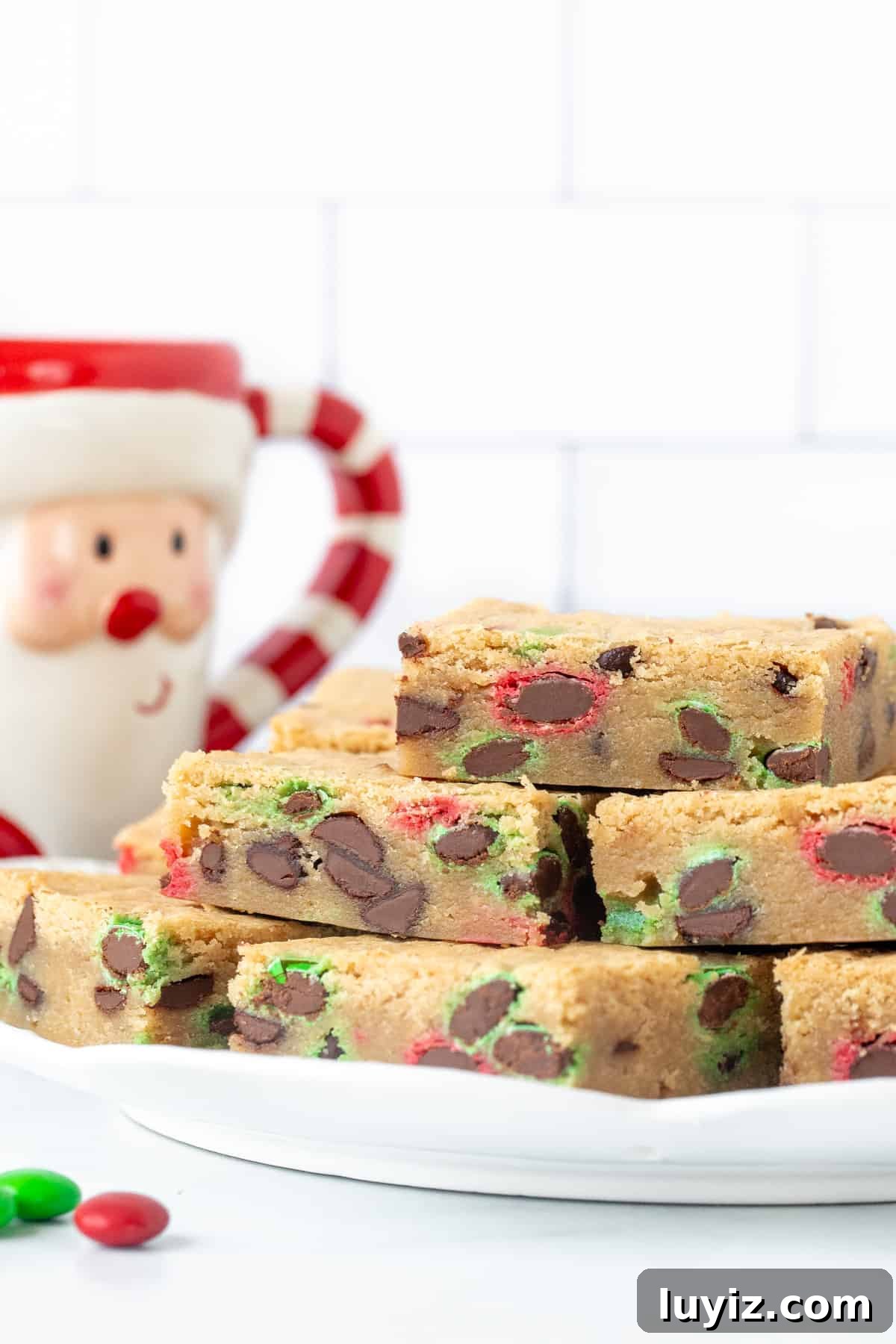 Christmas M&M Cookie Bars Recipe — Festive Holiday Treat 3 Plate of M&M cookie bars, stacked on top of each other
