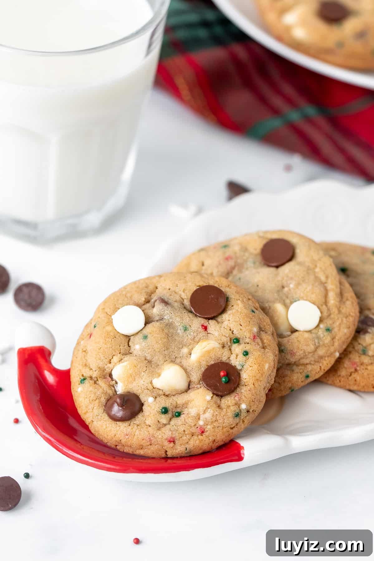 Christmas Chocolate Chip Cookies Recipe: Festive Soft-Baked Treats 3 Small Santa plate of chocolate chip cookies with sprinkles and a glass of milk