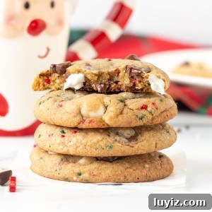 Stack of Christmas chocolate chip cookies with top cookie broken in half