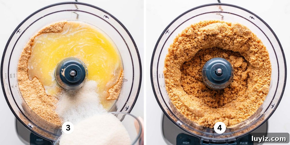 Creamy Lemon Cheesecake Recipe with Zesty Citrus Glaze 6 Adding melted butter and granulated sugar to graham cracker crumbs in a food processor on a white background.