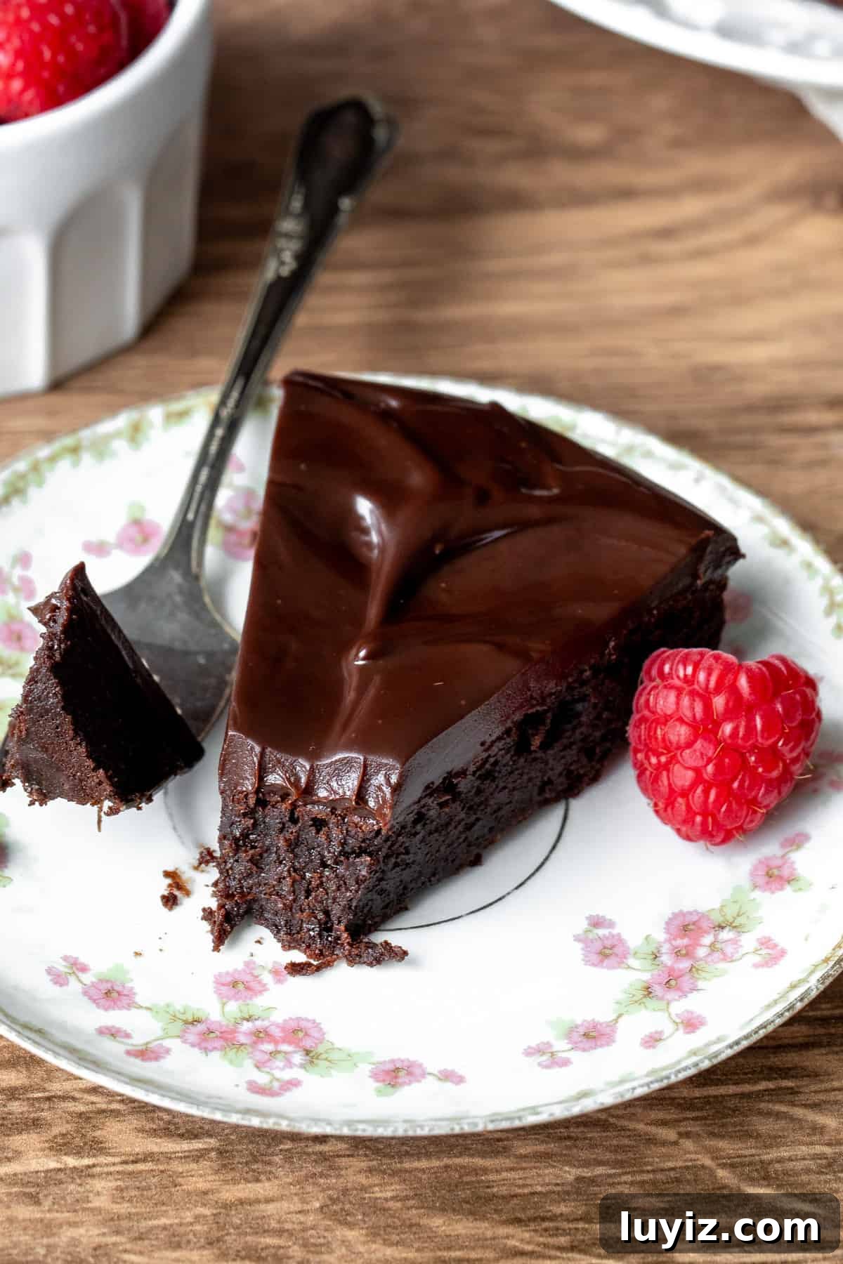 Decadent Flourless Chocolate Cake Recipe (Gluten-Free) 9 Slice of flourless chocolate cake with a bite taken out