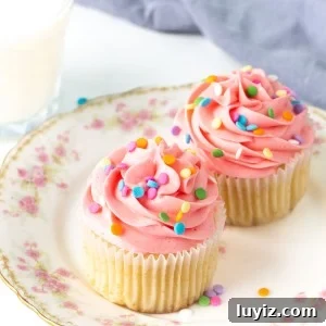 Perfect Vanilla Cupcakes for Two: Simple Small-Batch Recipe 8 Vanilla cupcakes for two on a plate with glass of milk