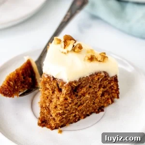 Mini Carrot Cake Recipe: Moist Layered Cupcakes for Any Occasion 9 Slice of miniature carrot cake with a bite taken out