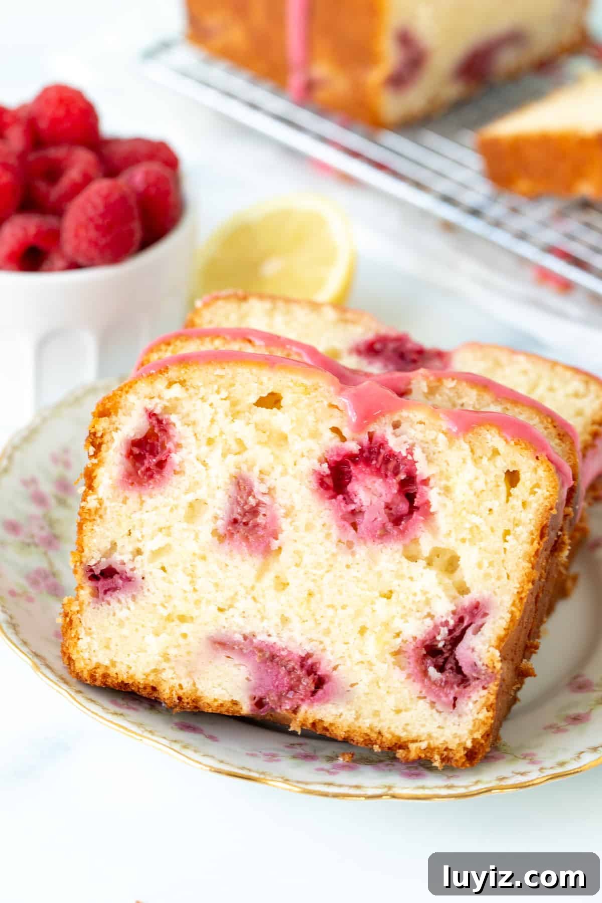 Zesty Lemon Raspberry Quick Bread Recipe 2 Slices of lemon raspberry loaf on a plate