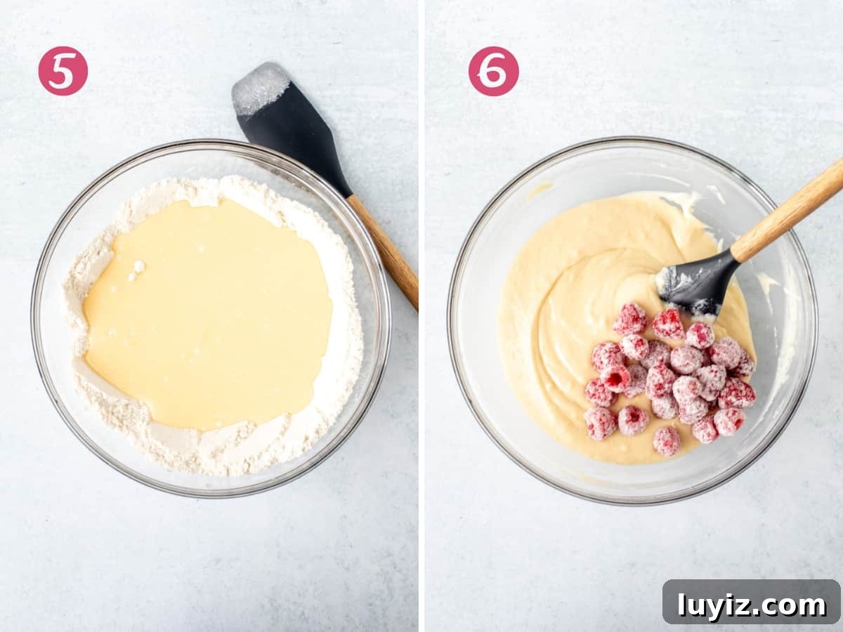 Zesty Lemon Raspberry Quick Bread Recipe 6 Bowl of wet ingredients poured into the dry ingredients, and bowl of lemon loaf batter with raspberries added into the bowl.