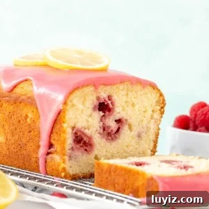 Lemon raspberry bread with rasbperry glaze on a cooling rack