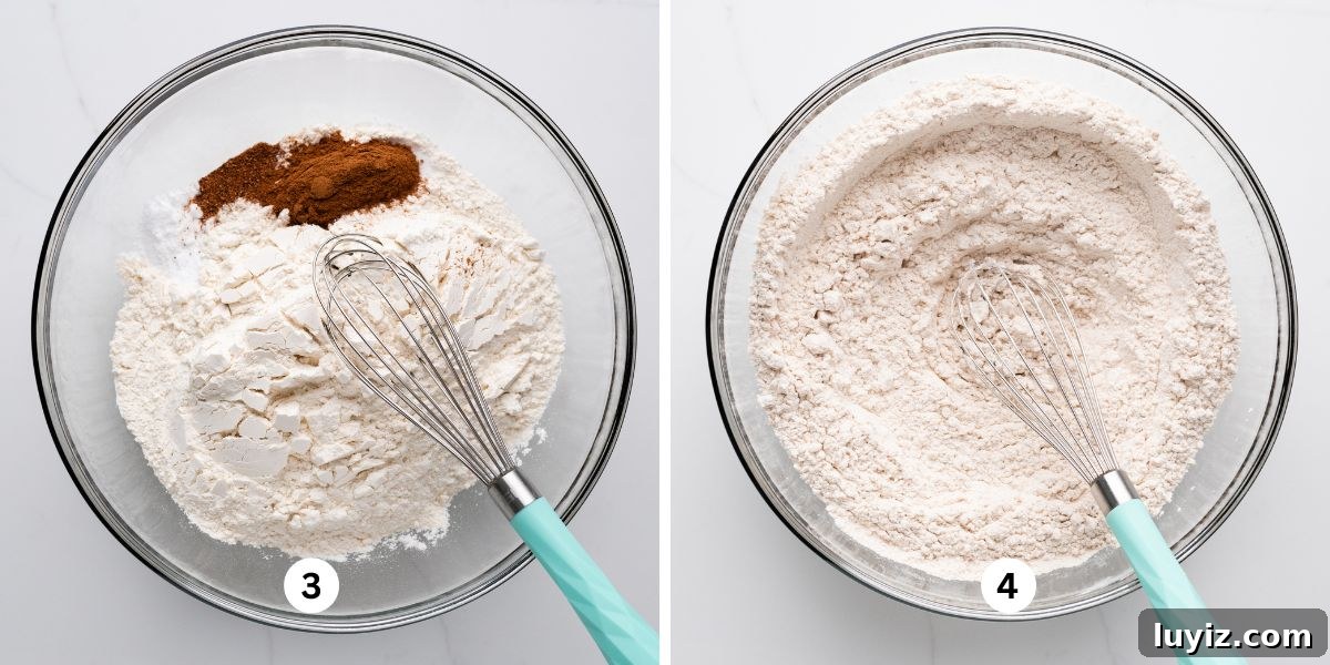Carrot Cake Cookie Recipe: Moist, Spiced Cookies with Cream Cheese Frosting 7 Whisking all-purpose flour, cinnamon, nutmeg, and salt together in a large glass bowl on a white quartz background.