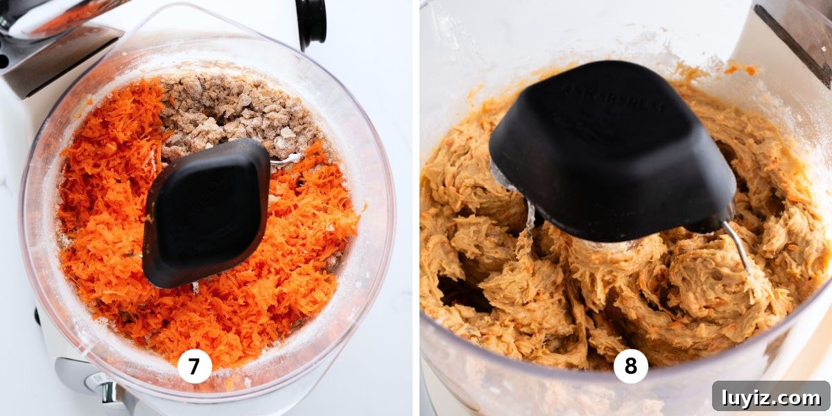 Carrot Cake Cookie Recipe: Moist, Spiced Cookies with Cream Cheese Frosting 9 Adding grated carrots to carrot cake cookie dough mixture in an Ankarsrum creme light mixer on white quartz background.