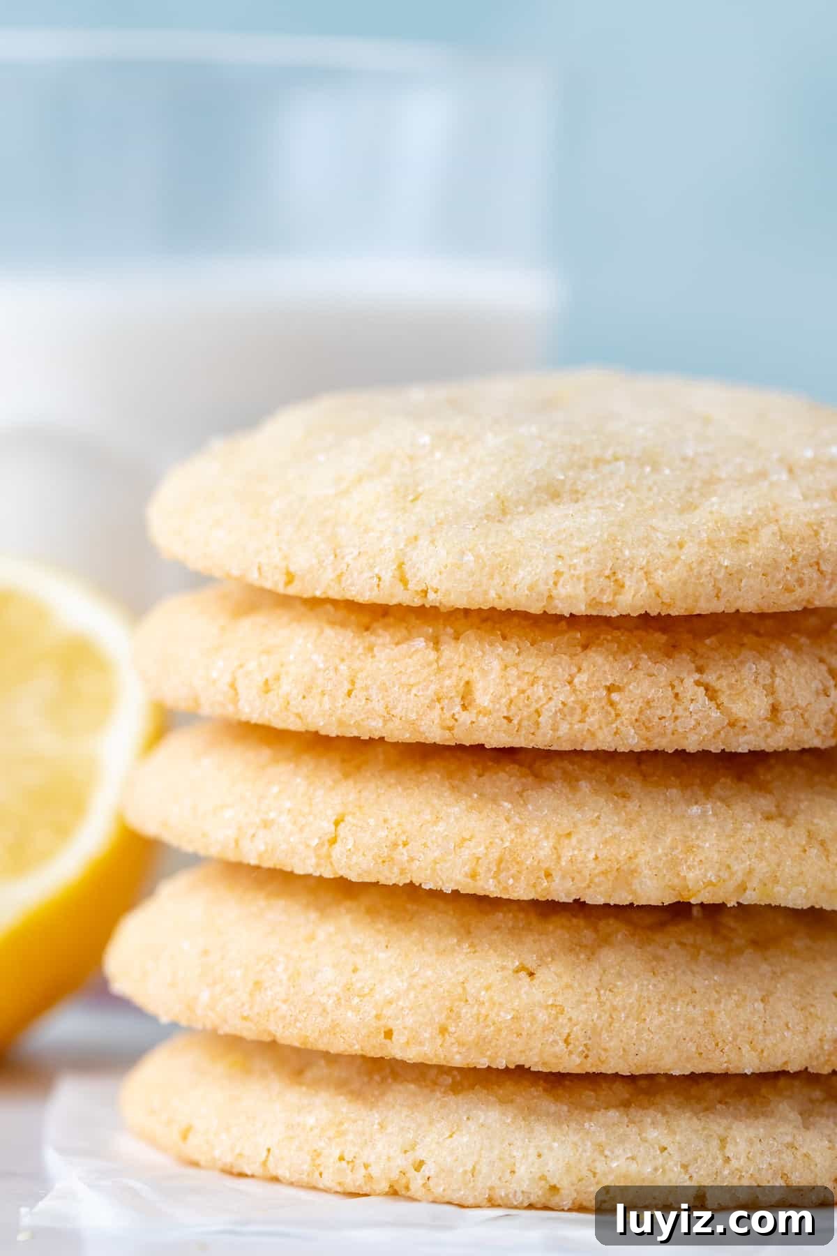 Crisp Lemon Sugar Cookies with Zesty Glaze Recipe 3 Stack of lemon cookies with glass of milk