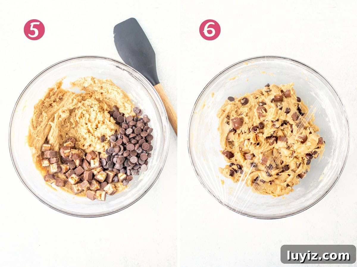 Snickers Stuffed Chocolate Chip Cookies: Gooey Caramel & Peanuts 5 Bowl of cookie dough with chocolate chips and chopped Snickers, and bowl of Snickers cookie dough covered in plastic wrap