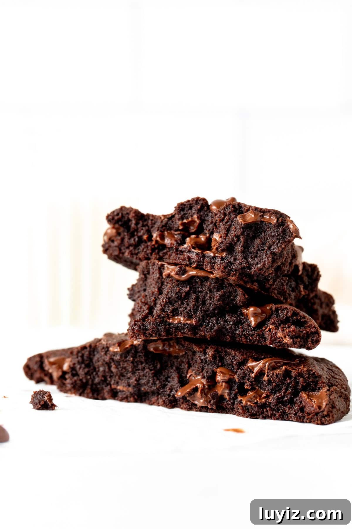 Single-Serve Chocolate Cookie Recipe for One (Quick & Gooey) 8 Single serving double chocolate cookie broken into pieces, with pieces stacked on top of each other