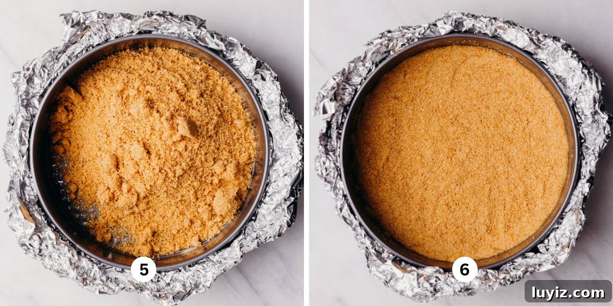 Pecan Pie Cheesecake Recipe — Decadent Homemade Dessert 6 Forming the graham cracker crust in a foil lined springform pan on a white background.