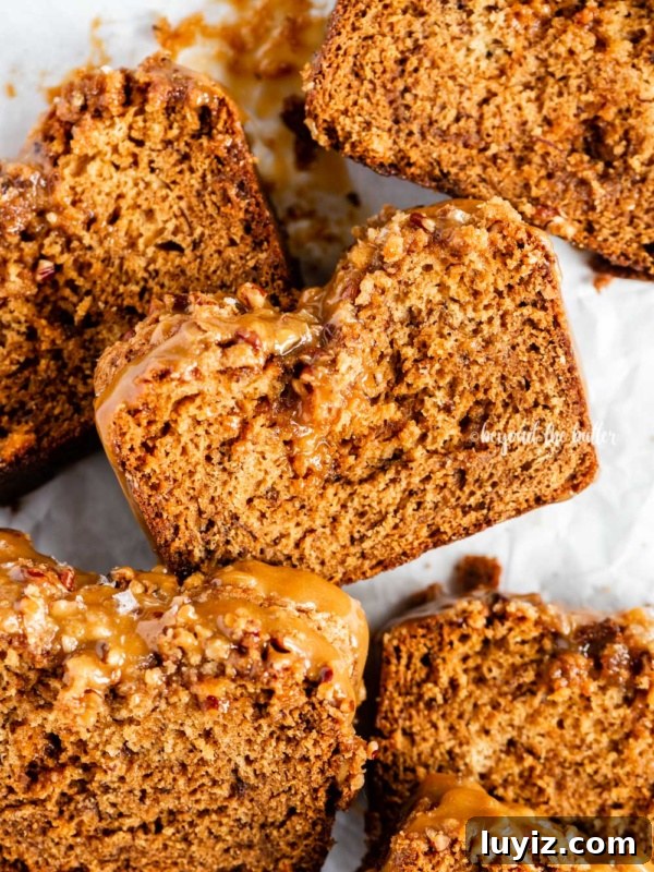Decadent Brownie Loaf Recipe: Fudgy Chocolate Bread Tutorial 14 Closeup overhead image of slices of salted caramel banana nut bread on parchment paper.