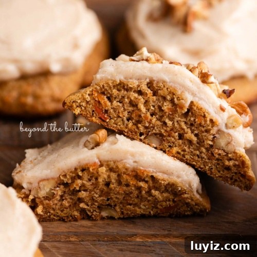 15 Delightful Easter Desserts to Impress Your Guests 4 Brown butter cream cheese frosted and unfrosted carrot cake cookies with a sprinkling of chopped pecans around some of the cookies on a dark wood background.
