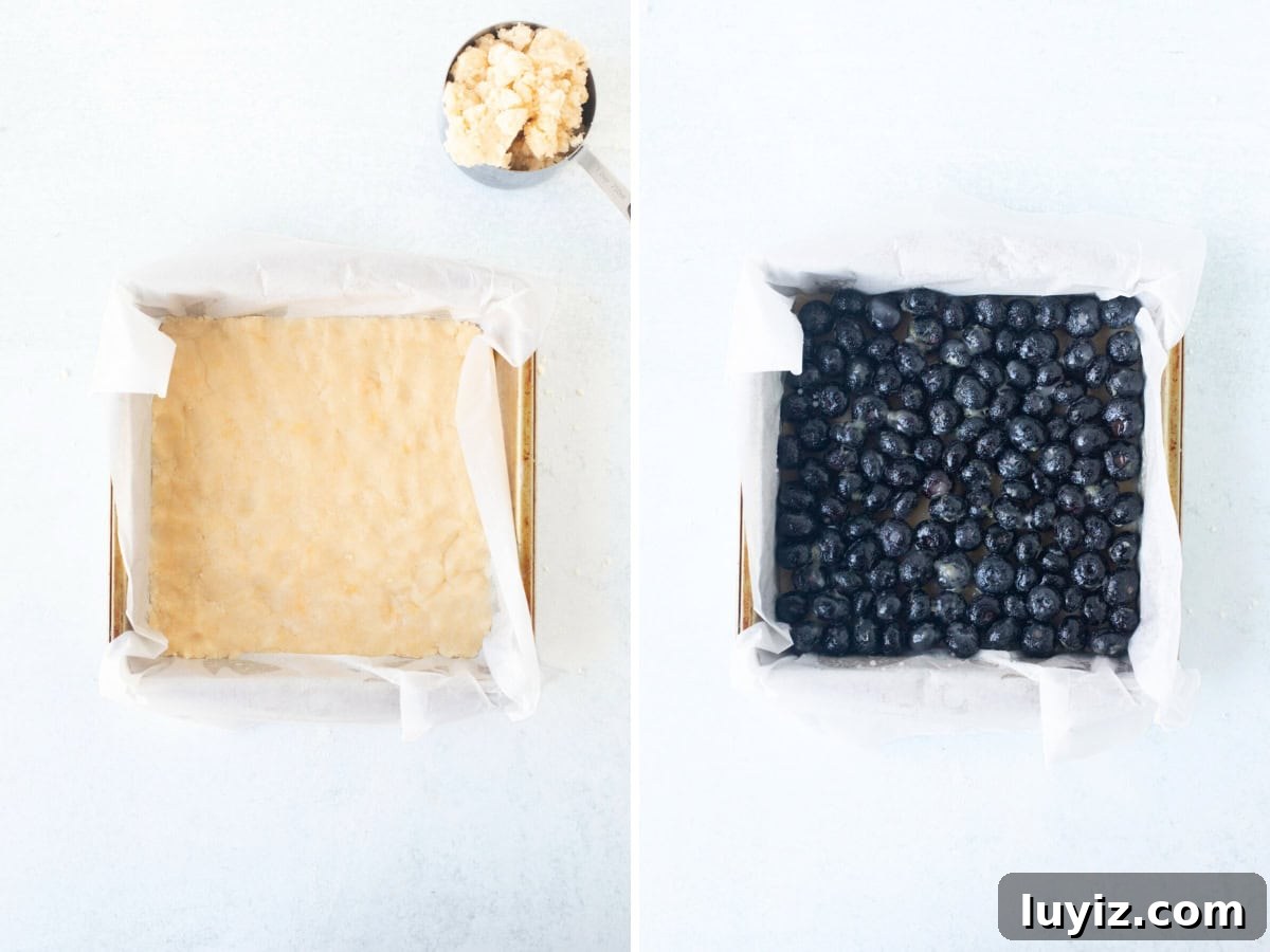 Blueberry Crumble Bars Recipe — Homemade Fruit Dessert Bars 6 Pan of unbaked shortbread base and pan of blueberry filling spooned on top of shortbread base