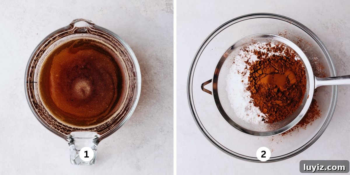 Light and Airy Chocolate Chiffon Cake Recipe 5 Dissolving espresso powder with warm water in a glass measuring cup and sifting flour and cocoa powder into a glass bowl on a white marbled background.