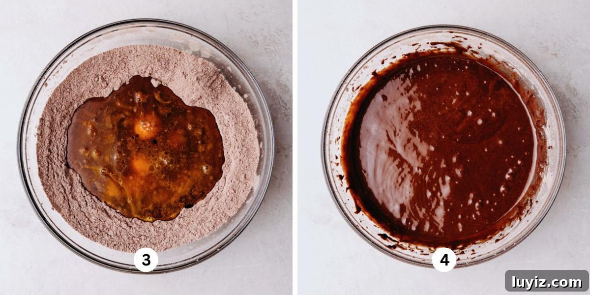 Light and Airy Chocolate Chiffon Cake Recipe 6 Wet ingredients added to the center well of dry ingredients in a glass bowl and a fully mixed bowl of chocolate chiffon cake batter in a glass bowl on a white marbled background.