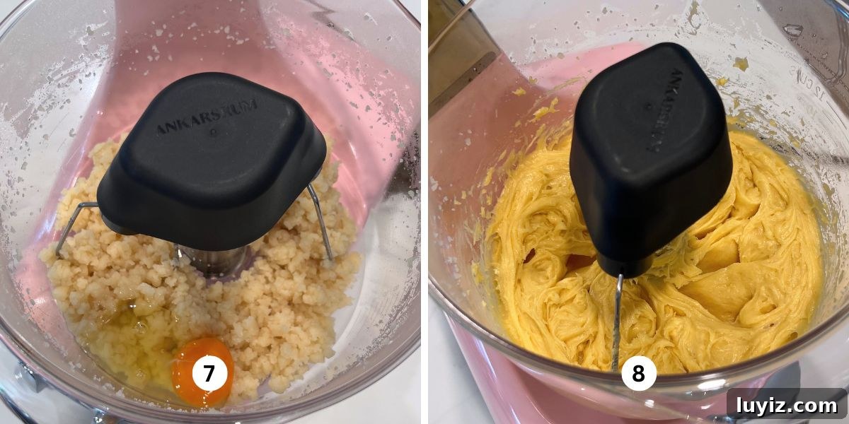 How to Make Classic Cream Puffs: Puff Pastry Filled with Vanilla Cream 8 Adding eggs one at a time to choux pastry mixture in a cloudy pink colored Ankarsrum assistent original mixer.