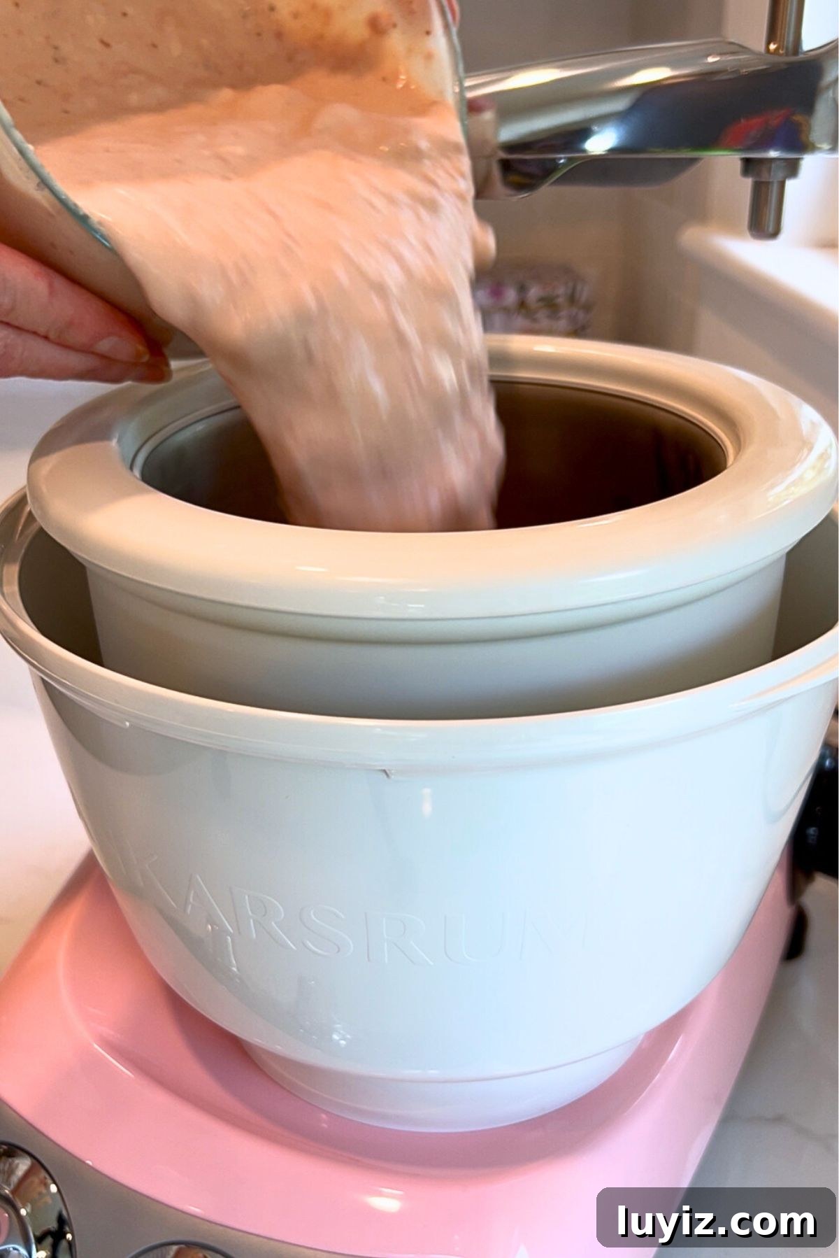 Creamy Homemade Strawberry Ice Cream Recipe You’ll Love 9 Pouring the strawberry ice cream base into the Cloudy Pink Ankarsrum Assistent Original Mixer and ice cream maker on low speed.
