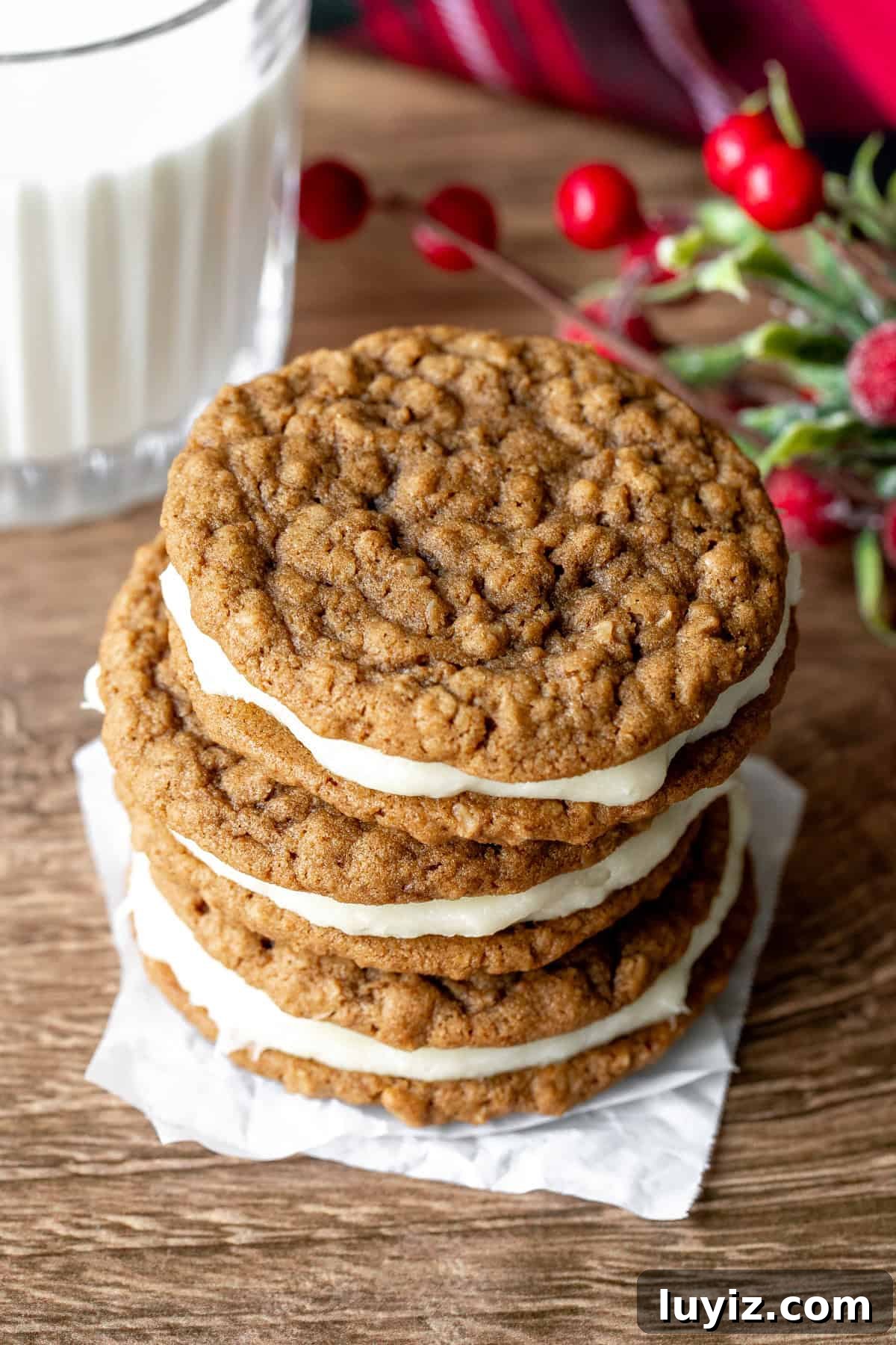 Gingerbread Oatmeal Cream Pies Recipe — Soft Spiced Sandwich Cookies 2 Three gingerbread oatmeal cream pies, stacked on top of each other