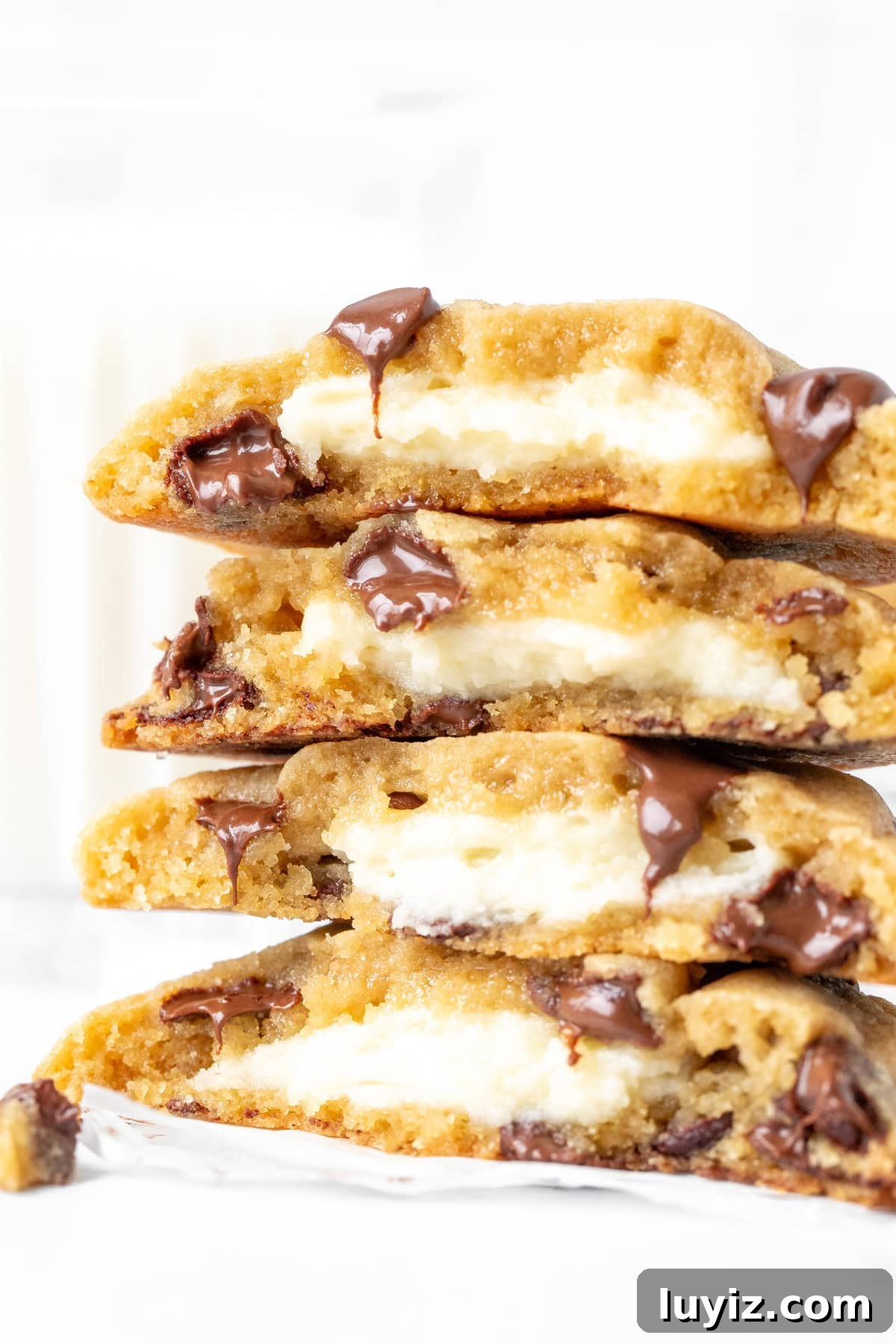Cheesecake-Stuffed Chocolate Chip Cookies — Decadent Dessert Recipe 8 4 half cream cheese stuffed chocolate chip cookies, on top of each other