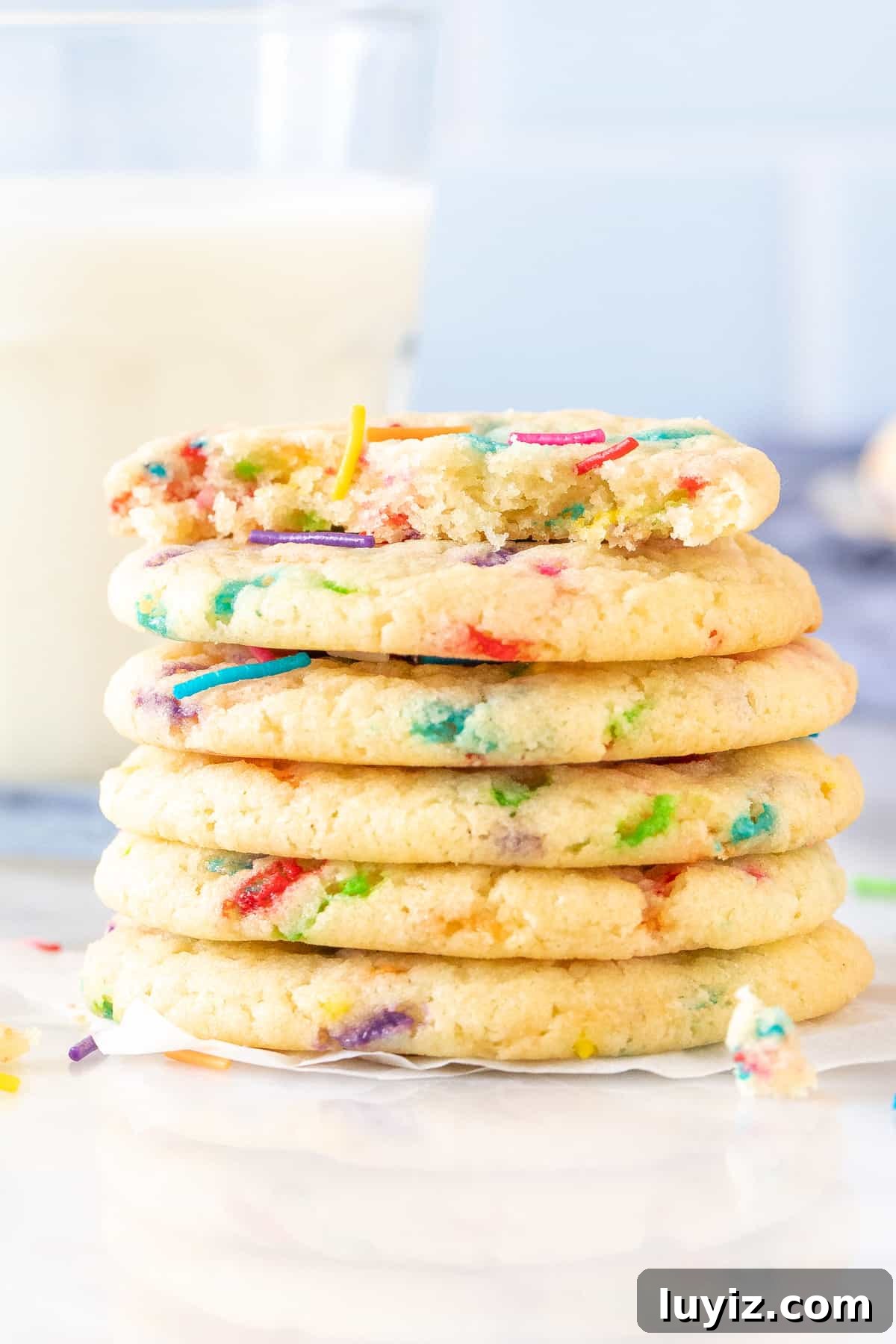 Homemade Funfetti Cookies: Soft, Chewy Recipe from Scratch 5 Stack of sprinkle cookies, with the top cookie broken in half