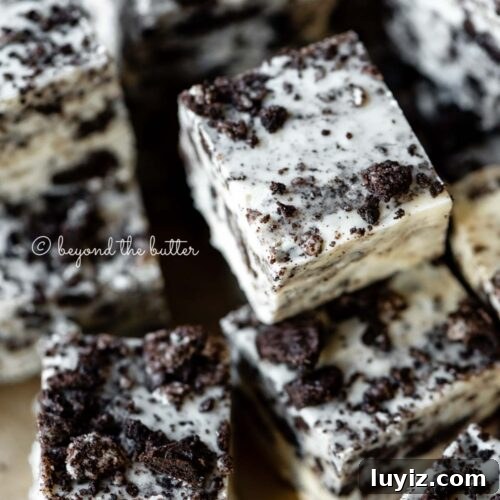 Randomly stacked pieces of cookies and cream fudge.