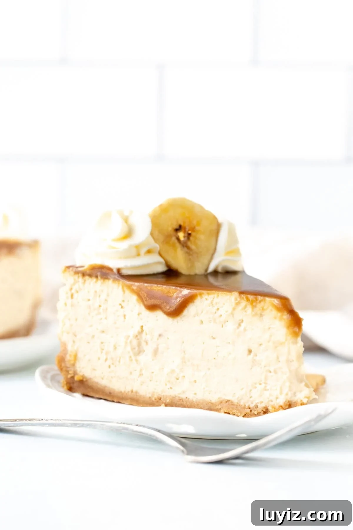 Banoffee Cheesecake Recipe: Creamy Banana & Caramel Cheesecake 3 Slice of banoffee pie cheesecake with caramel and whipped crema on top