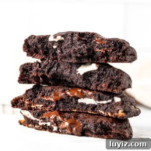 Ultimate Triple Chocolate Chip Cookies Recipe for Chocolate Lovers 9 Triple chocolate cookies, broken in half and each half stacked on top of each other