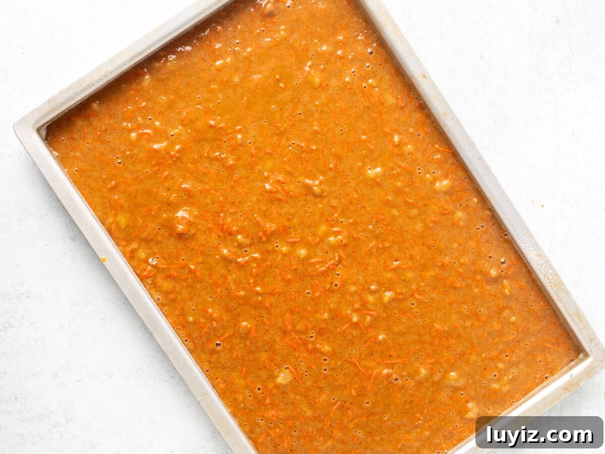 Chewy Carrot Cake Bars with Cream Cheese Frosting 6 jelly roll pan of unbaked carrot cake bars