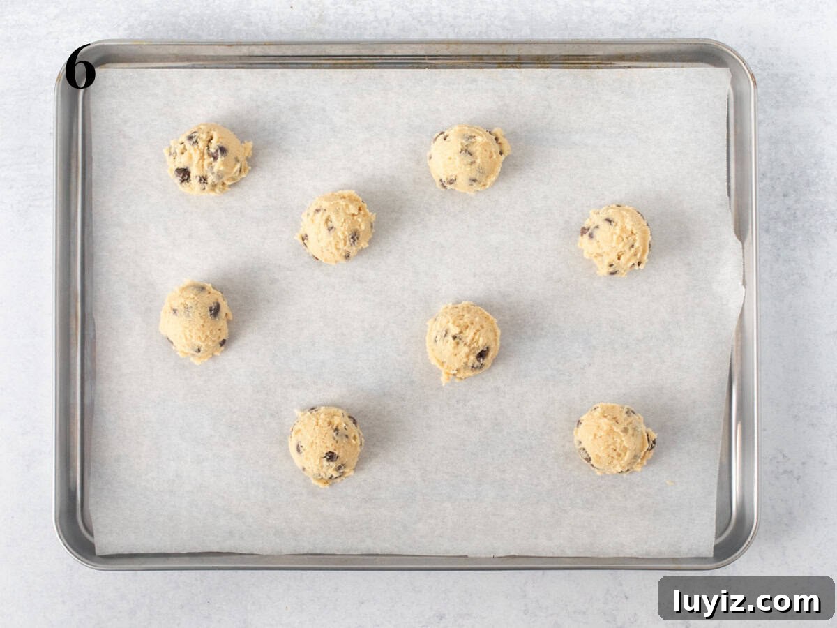 Classic Chocolate Chip Cookies for Everyday Baking 7 Cookie dough balls on a cookie sheet