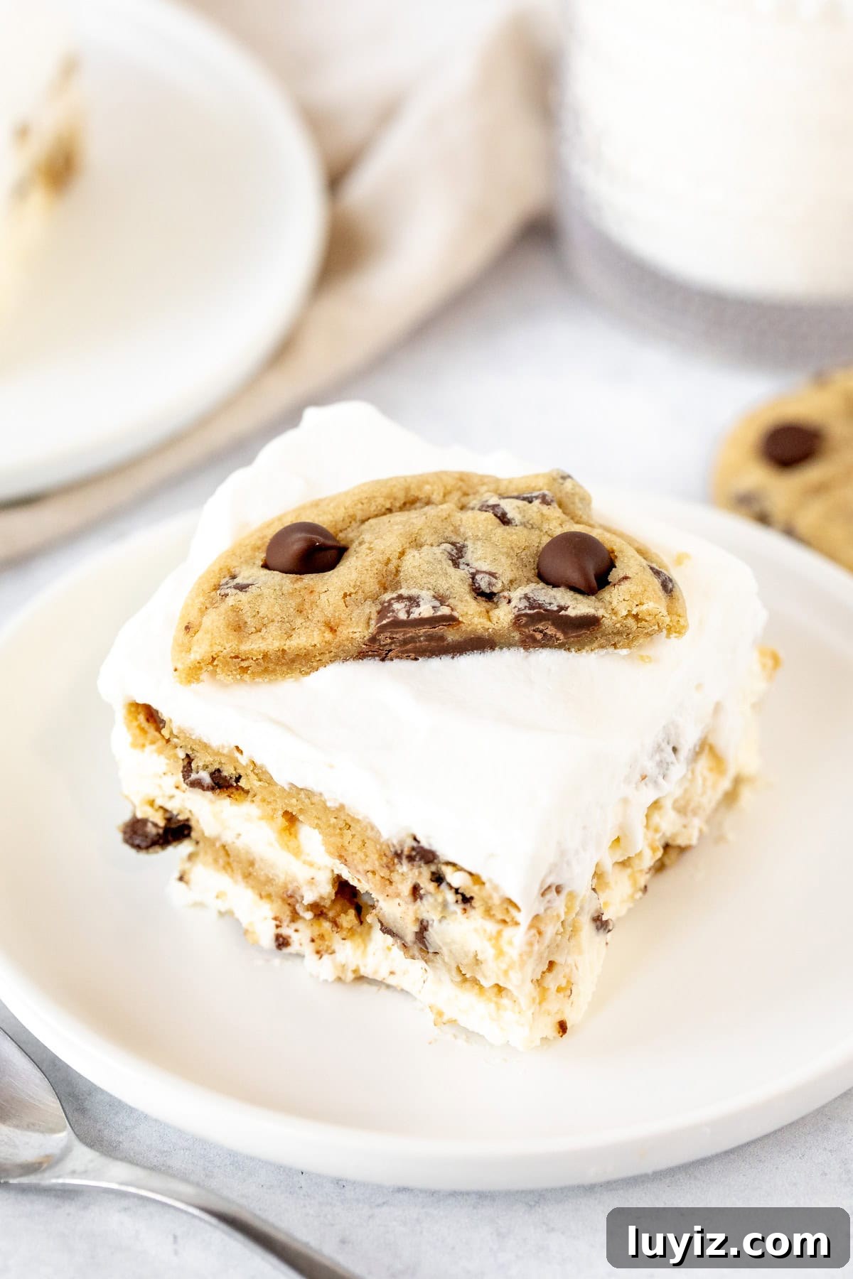 No-Bake Chocolate Chip Cookie Icebox Cake Recipe 3 Square piece of cookie icebox cake on a plate