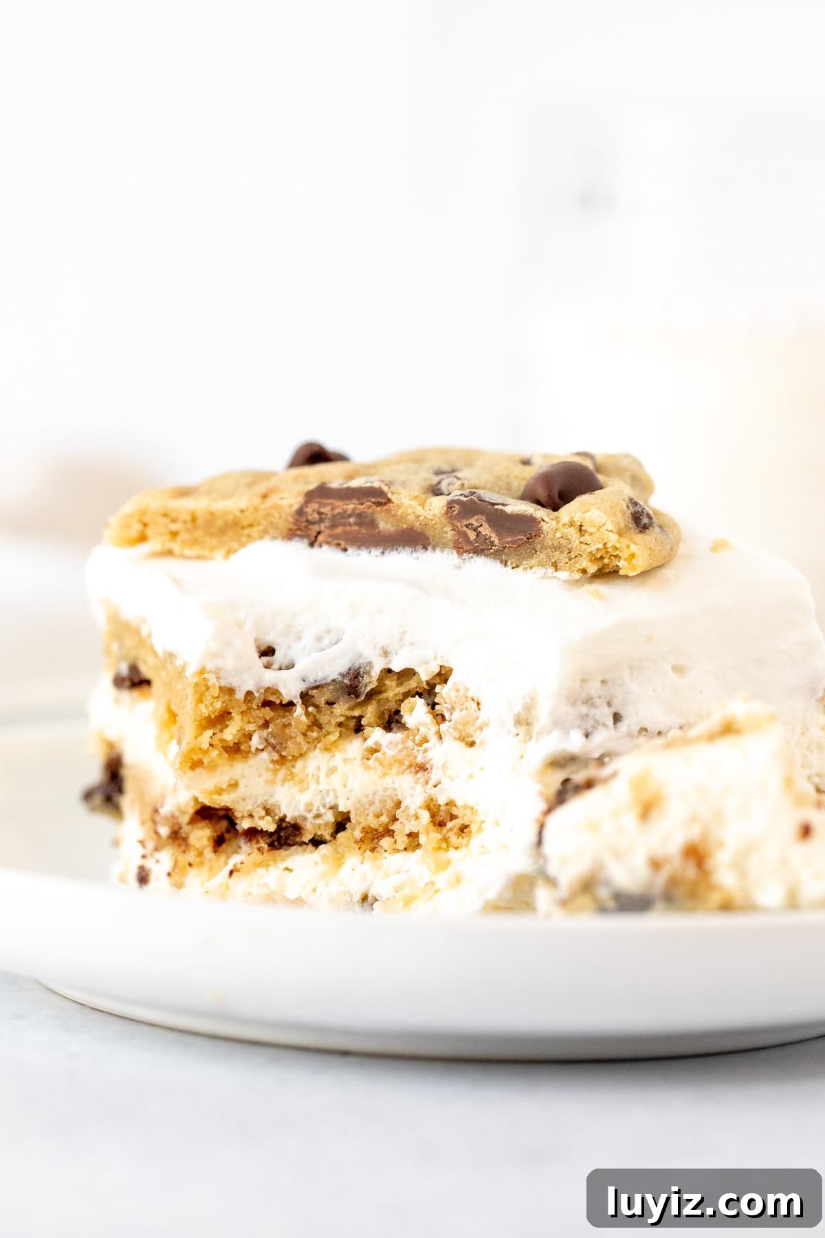 No-Bake Chocolate Chip Cookie Icebox Cake Recipe 6 Slice of icebox cake with layers of no bake cheesecake filling and chocolate chip cookies