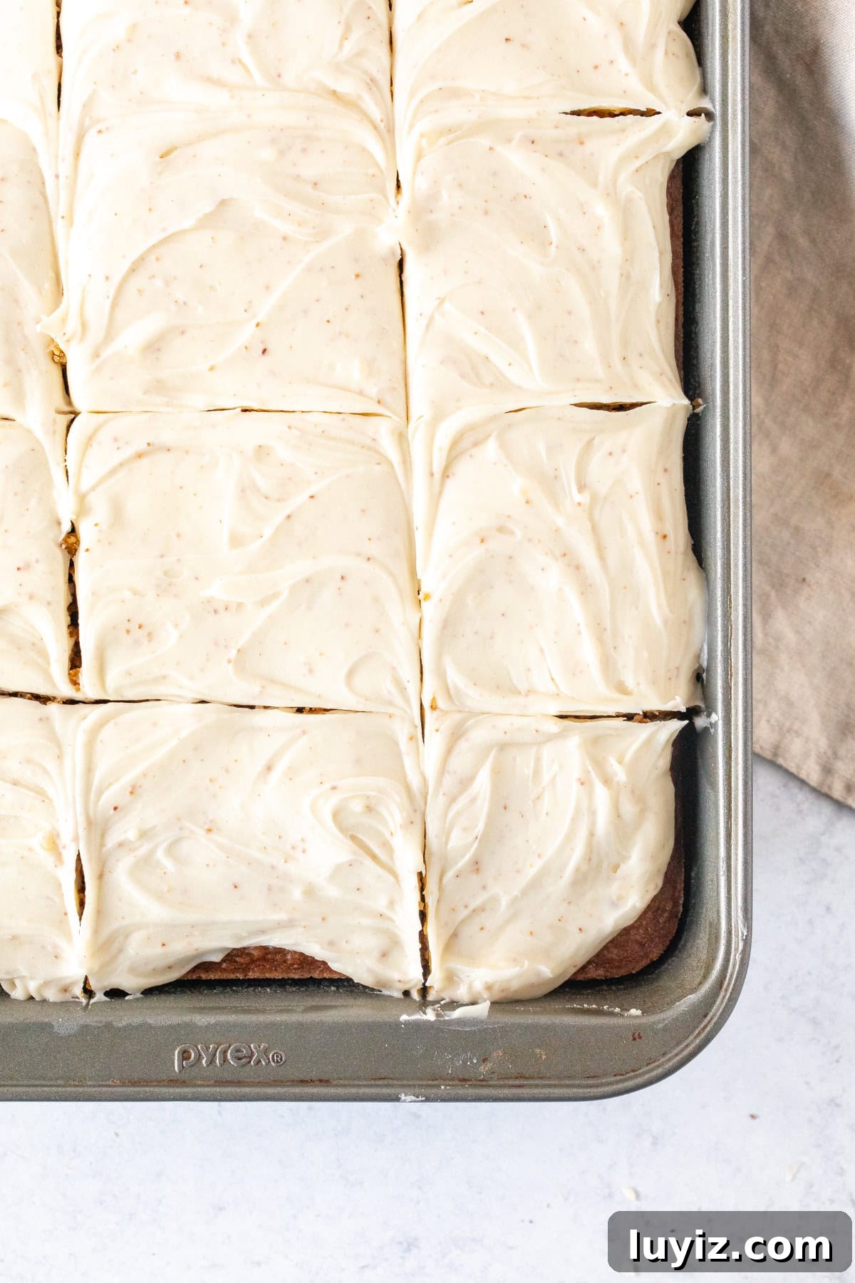 Ultimate Moist Pumpkin Cake Recipe for Fall Baking 9 9x13 inch pan of pumpkin cake topped with brown butter cream cheese frosting