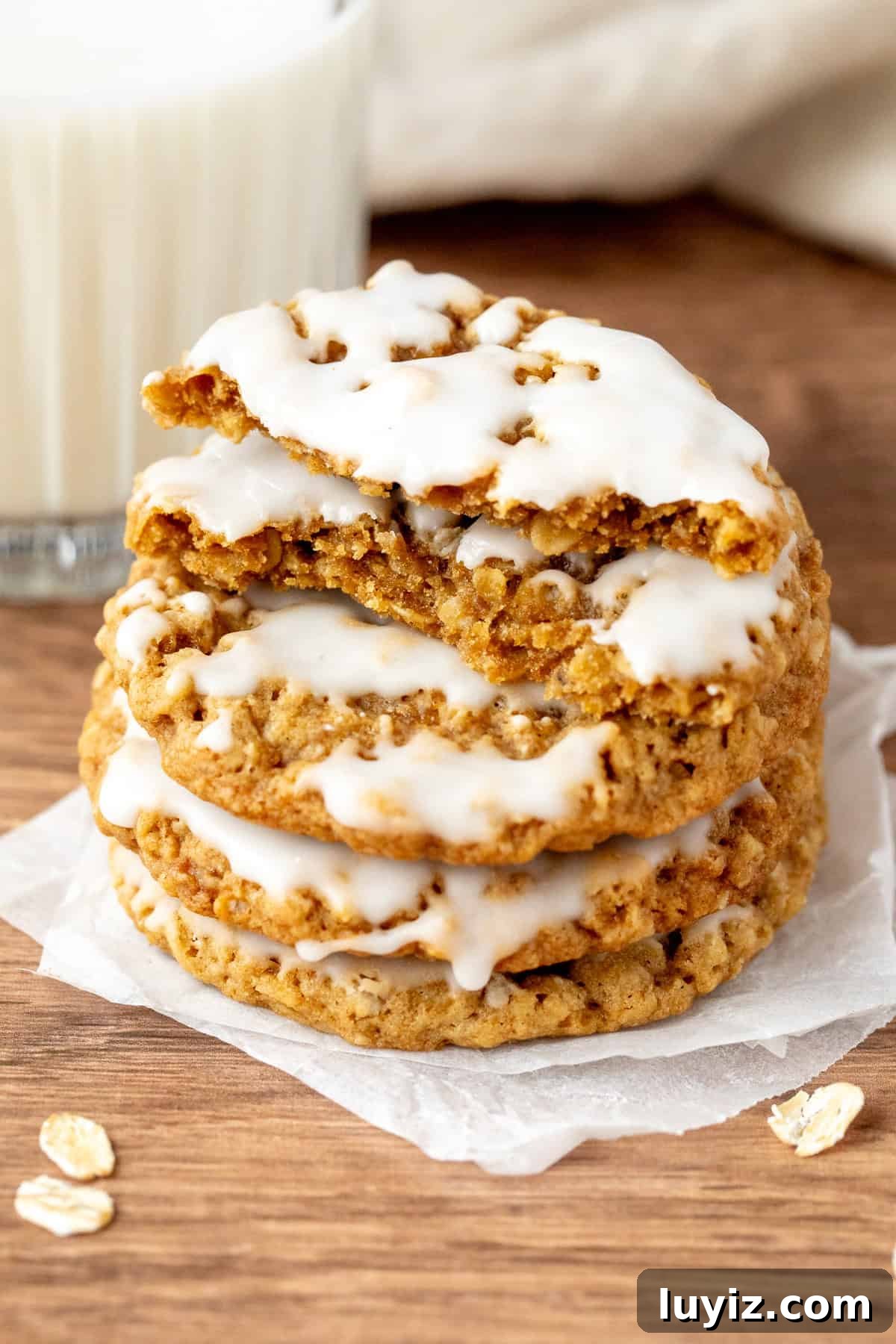 Iced Oatmeal Cookies Recipe with Soft Chewy Texture 6 Stack of iced oatmeal cookies with top cookie broken in half