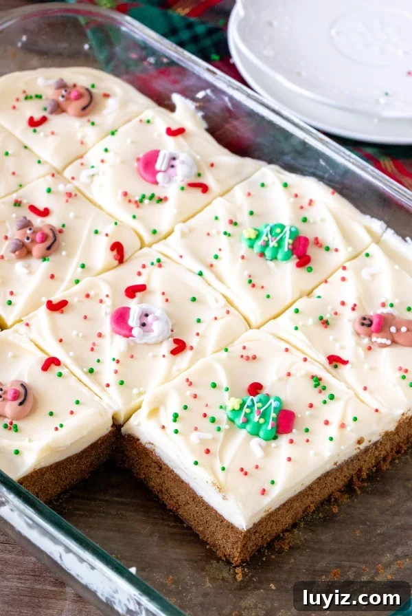 Gingerbread Oatmeal Cookies with Sweet Icing 8 9x13 inch pan of gingerbread cookie bars cut into squares.