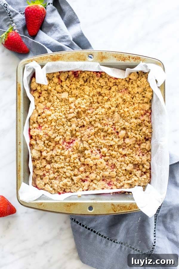 Homemade Strawberry Crumb Bars Recipe with Buttery Streusel 3 8x8 inch pan of crumb bars, fresh from the oven.