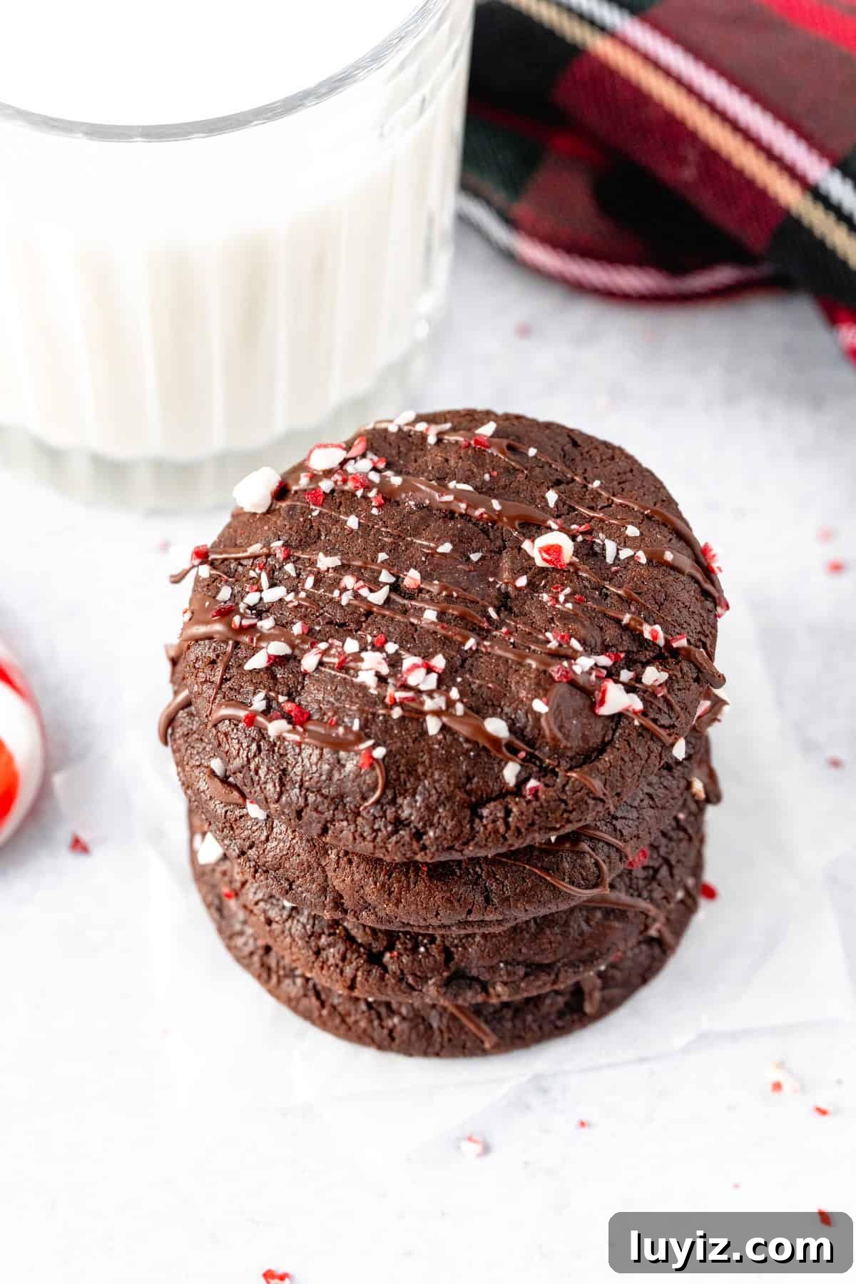Double Chocolate Peppermint Cookies Recipe for Holiday Baking 3 Stack of double chocolate peppermint cookies with glass of milk