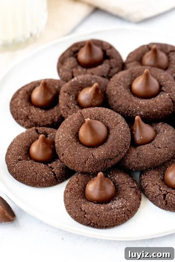 Double Chocolate Peppermint Cookies Recipe for Holiday Baking 7 plate of chocolate cookies with Hershey's chocolate kiss on top