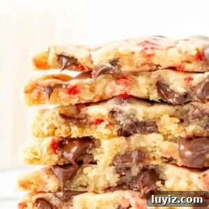Stack of candy cane chocolate chip cookies, broken in half