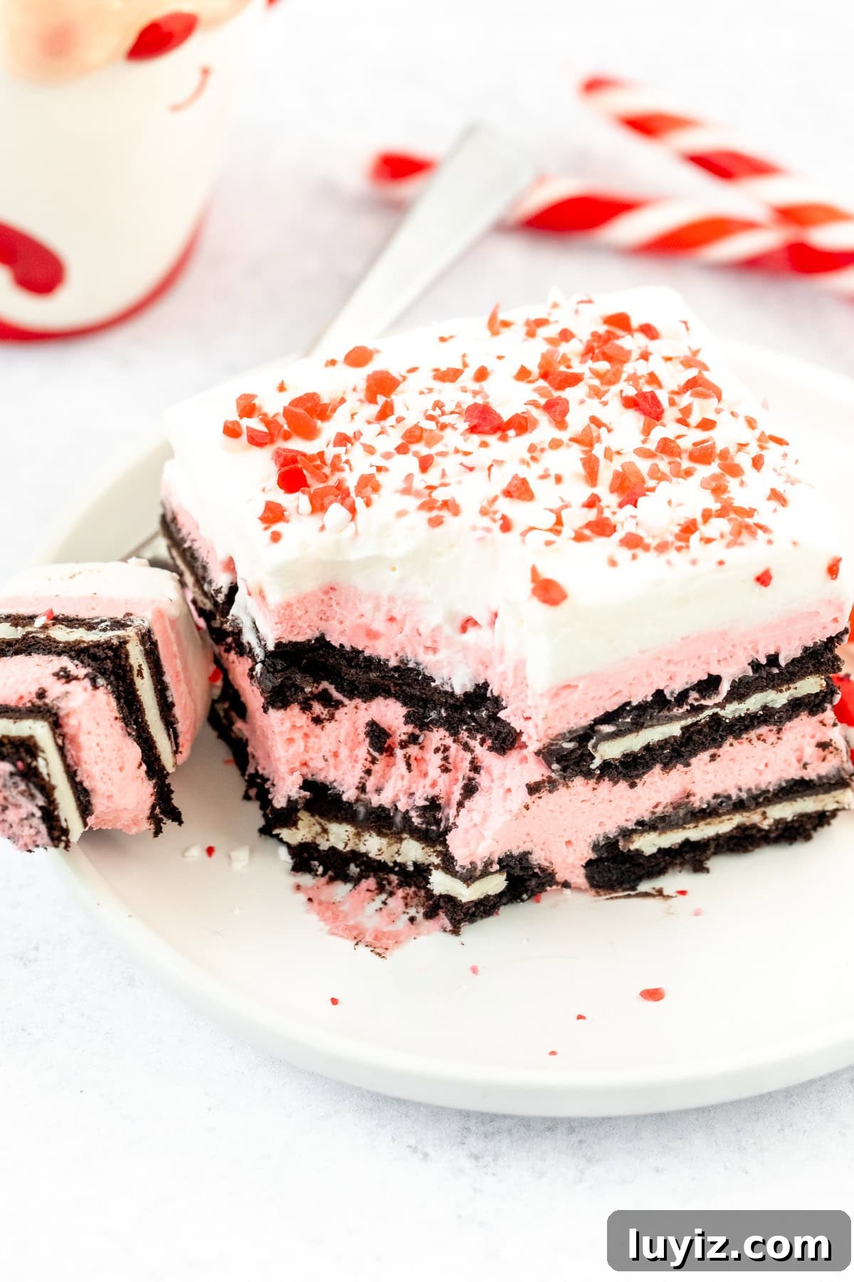 Peppermint Candy Cane Icebox Cake Recipe for the Holidays 3 Slice of peppermint Oreo icebox cake, with whipped cream and crushed candy canes on top