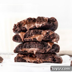 Double chocolate cookies, stuffed with Nutella and broken in half and stacked on top of one another
