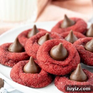 Red Velvet Blossoms: Elegant Floral Cakes and Desserts 8 Plate of red velvet blossom cookies, each cookie topped with a Hershey's Kiss
