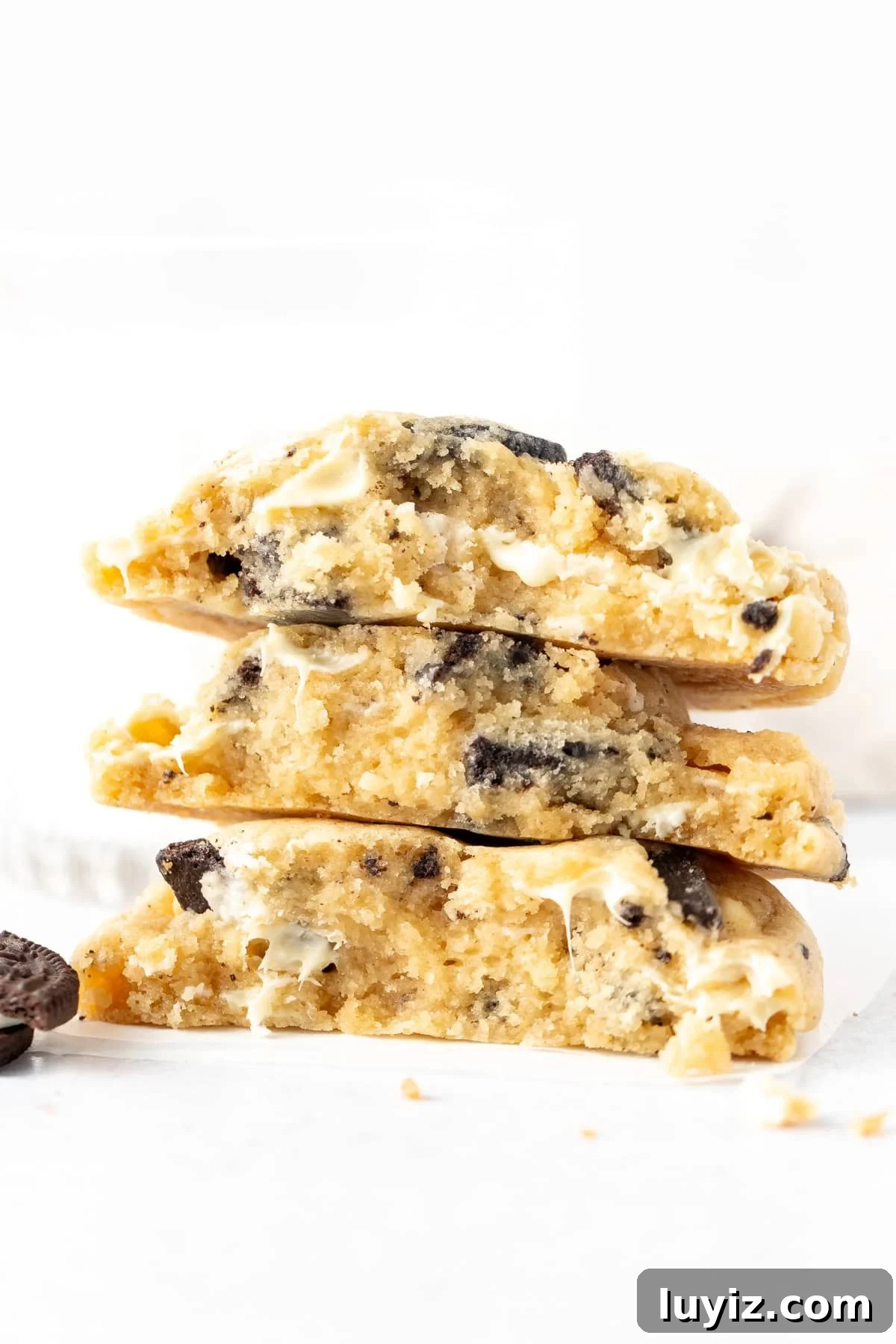 Bakery-Style Cookies & Cream Sandwich Cookies 2 Stack of cookies and cream cookies, broken in half