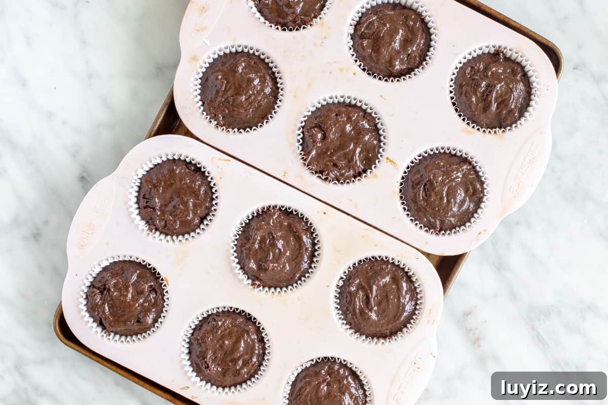 Decadent Double Chocolate Muffins: Moist, Rich Recipe 5 Muffin tin with chocolate muffin batter