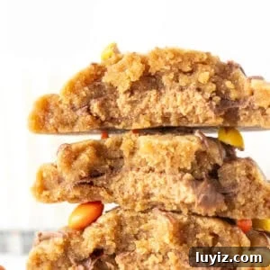 Peanut Butter Cookies Stuffed with Reese’s Cups 7 Peanut butter cookies stuffed with a peanut butter cup in the middle, broken in half and stacked on top of one another