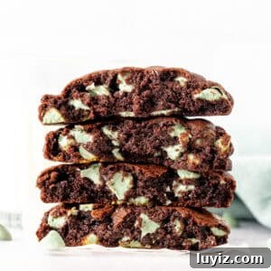 Mint Chip Chocolate Cookie Recipe for Rich, Minty Chocolate Flavor 5 Mint chip chocolate cookies broken in half, and stacked on top of one another
