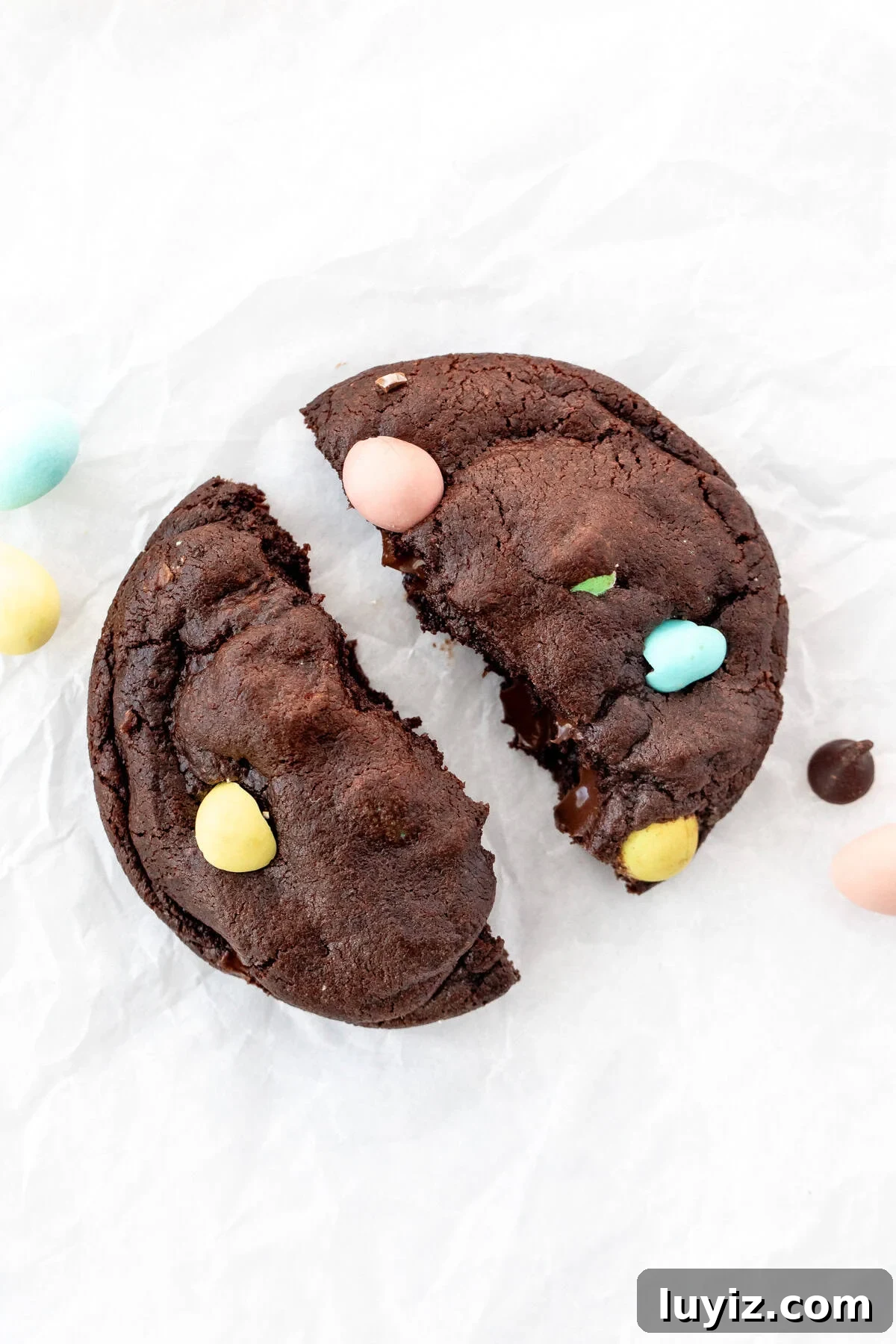 Mini Egg Chocolate Cookie Recipe: Soft Cookies with Candy Eggs 2 Mini Egg chocolate cookie, broken in half