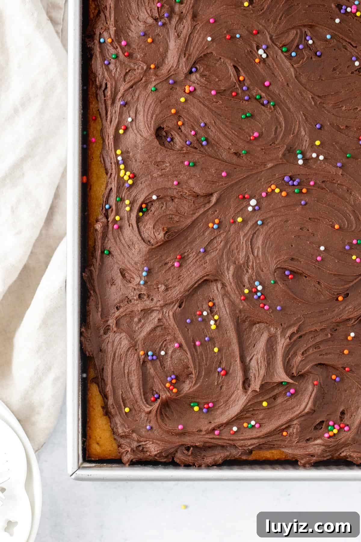 Moist Yellow Sheet Cake with Decadent Chocolate Frosting 8 Sheet pan of yellow vanilla cake with chocolate frosting